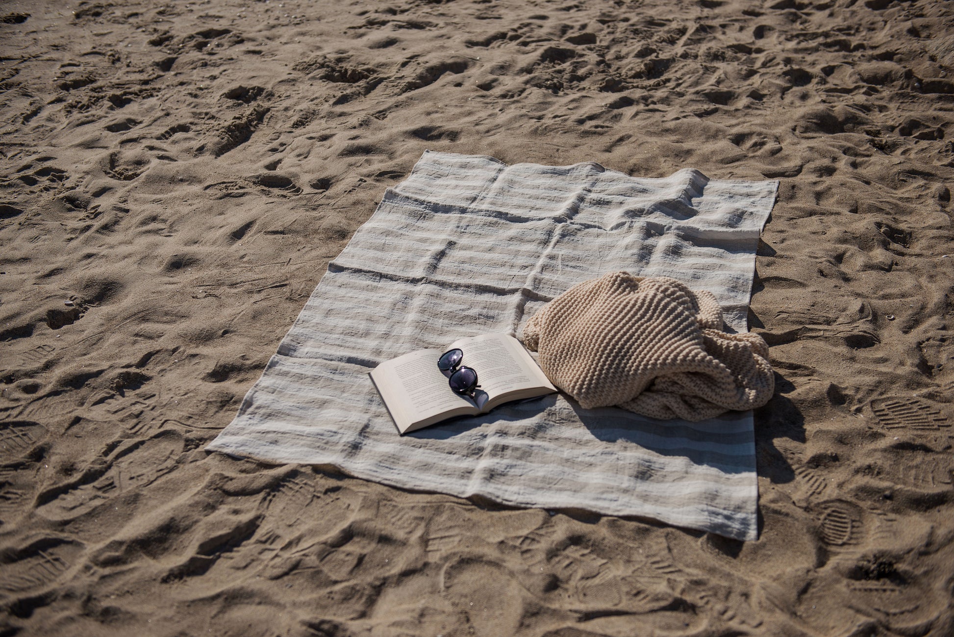 striped beach towel on the sand