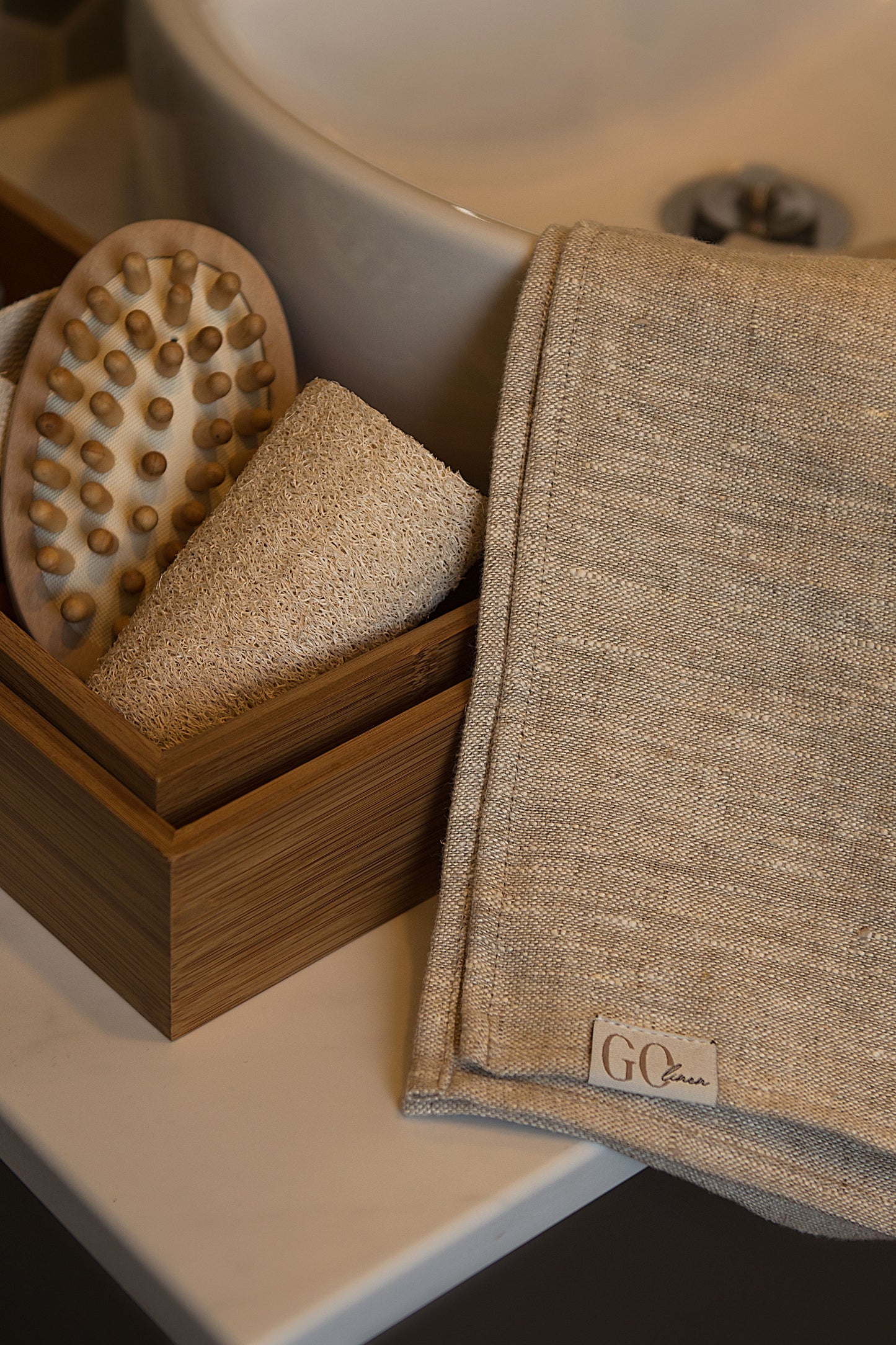 linen bath towel , on the sink