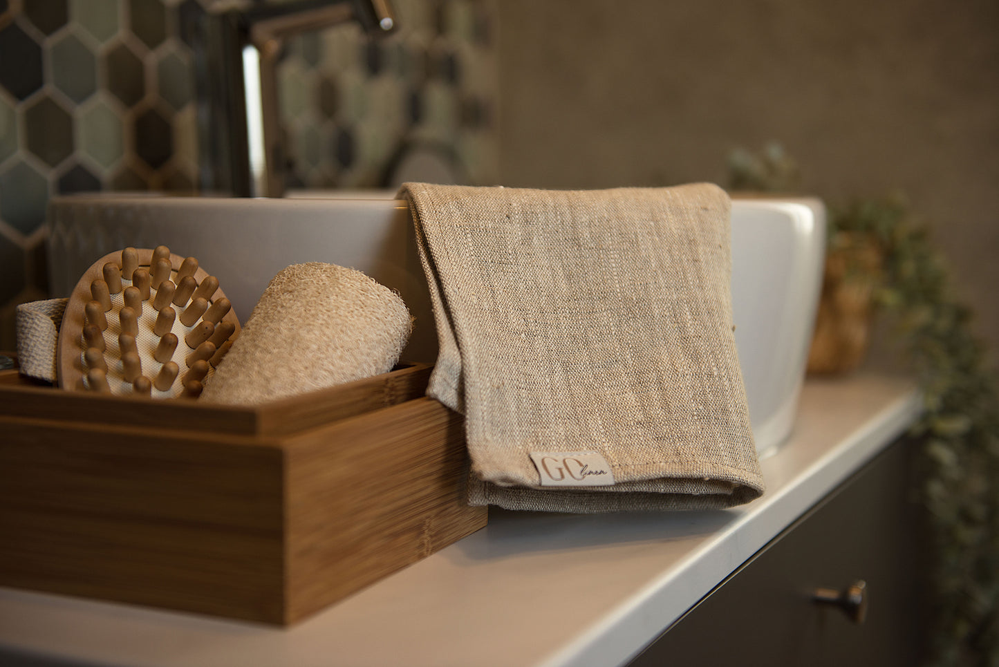 linen bath towel, folded on the sink