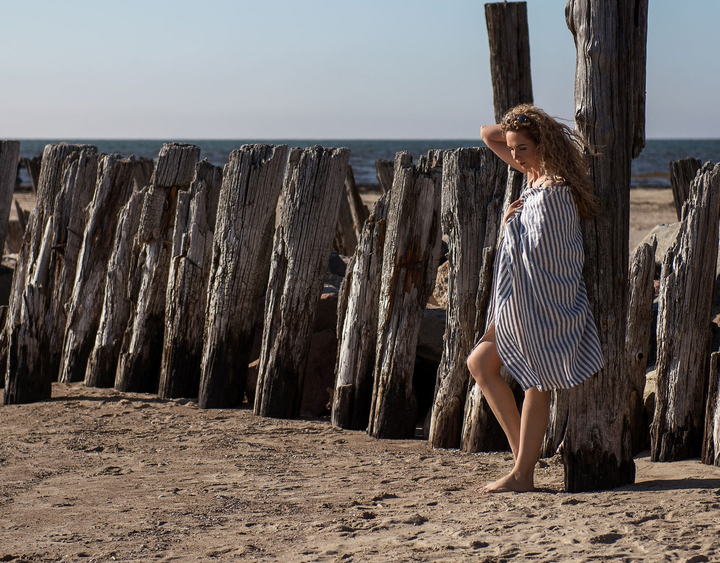 women wrapped on organic beach towel