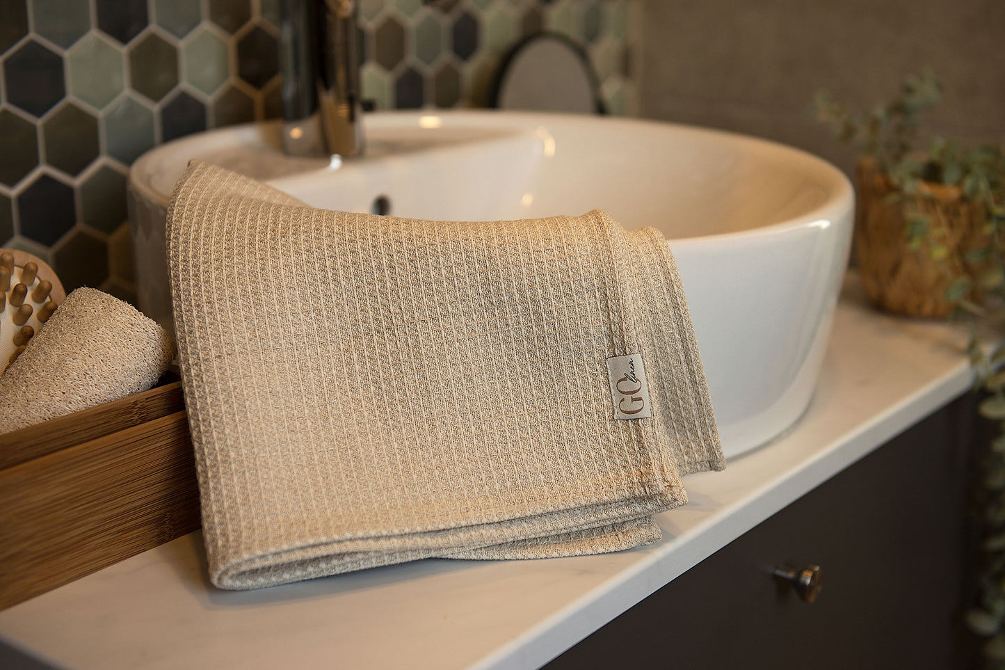 waffle bath towel hung on tke sink